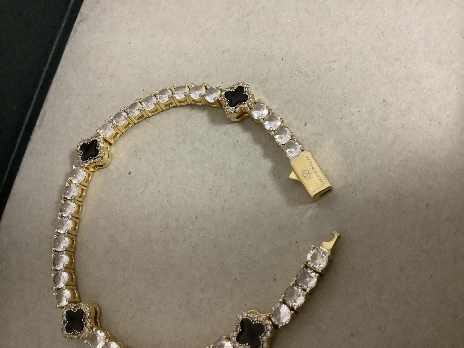 Imperium 18k gold plated CZs four leaf clover black enamel tennis bracelet 7″