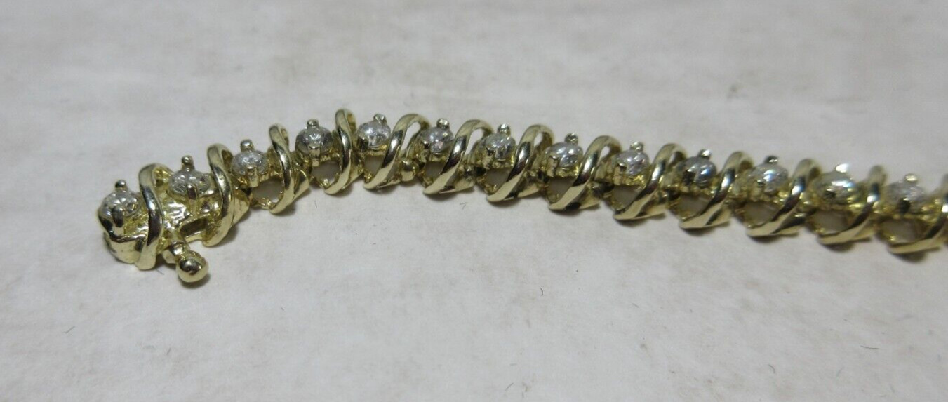 14K Yellow Gold tennis Bracelet, Wt 12.5g, locking 42 x 2.5mm diamonds si2 I1