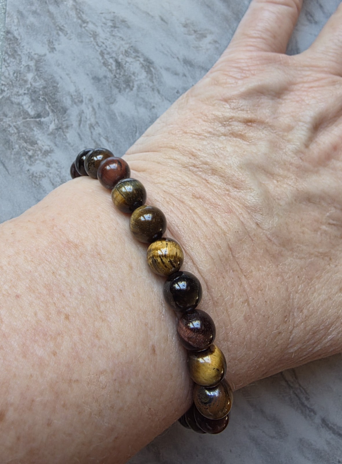 Natural Tiger’s Eye Stretch Bracelet 8-8.5mm Round, 6.50-8.00 Inches 75.0 ctw