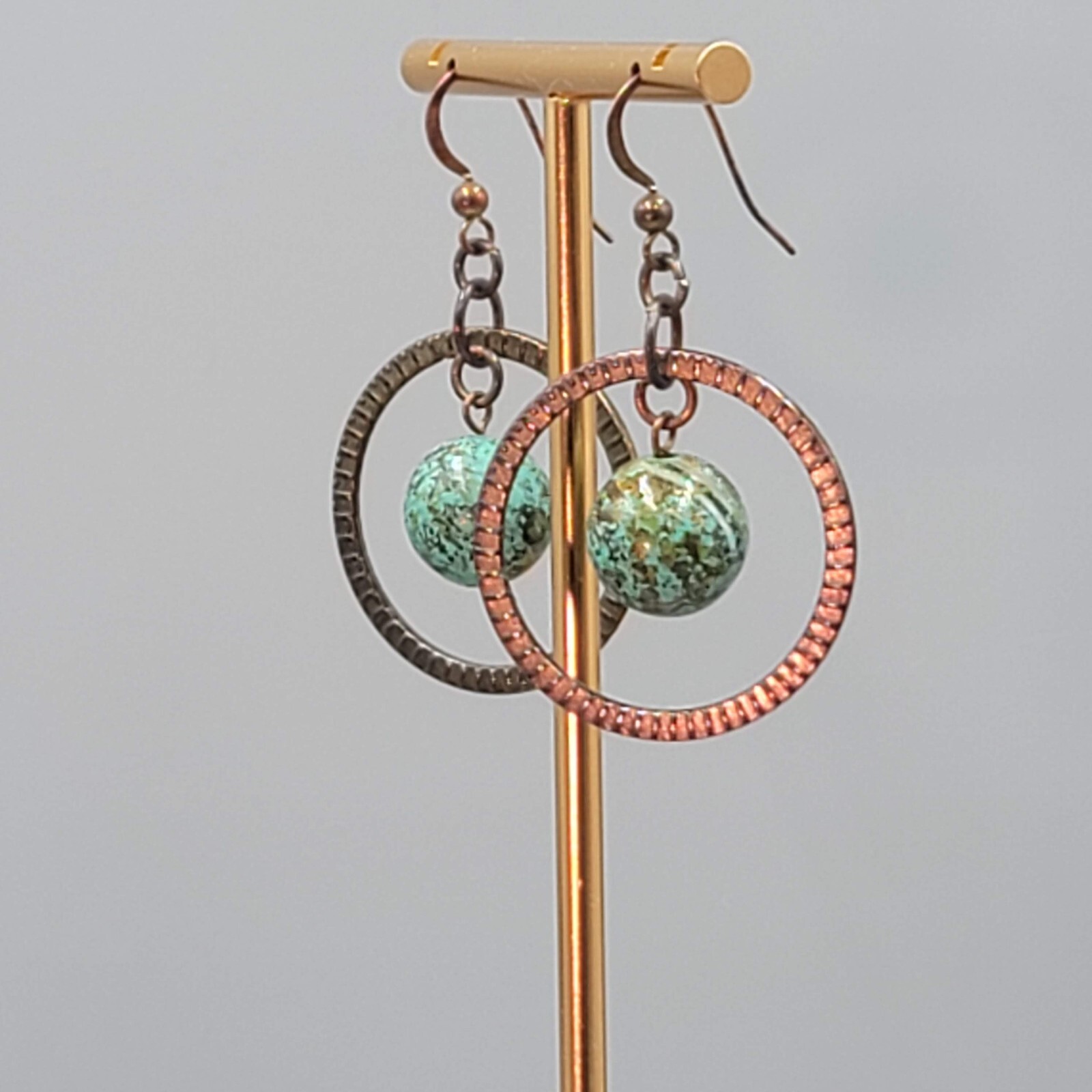 Bronze tone Dangle Pierced Earrings Green Bead Center Dangle 1.5″