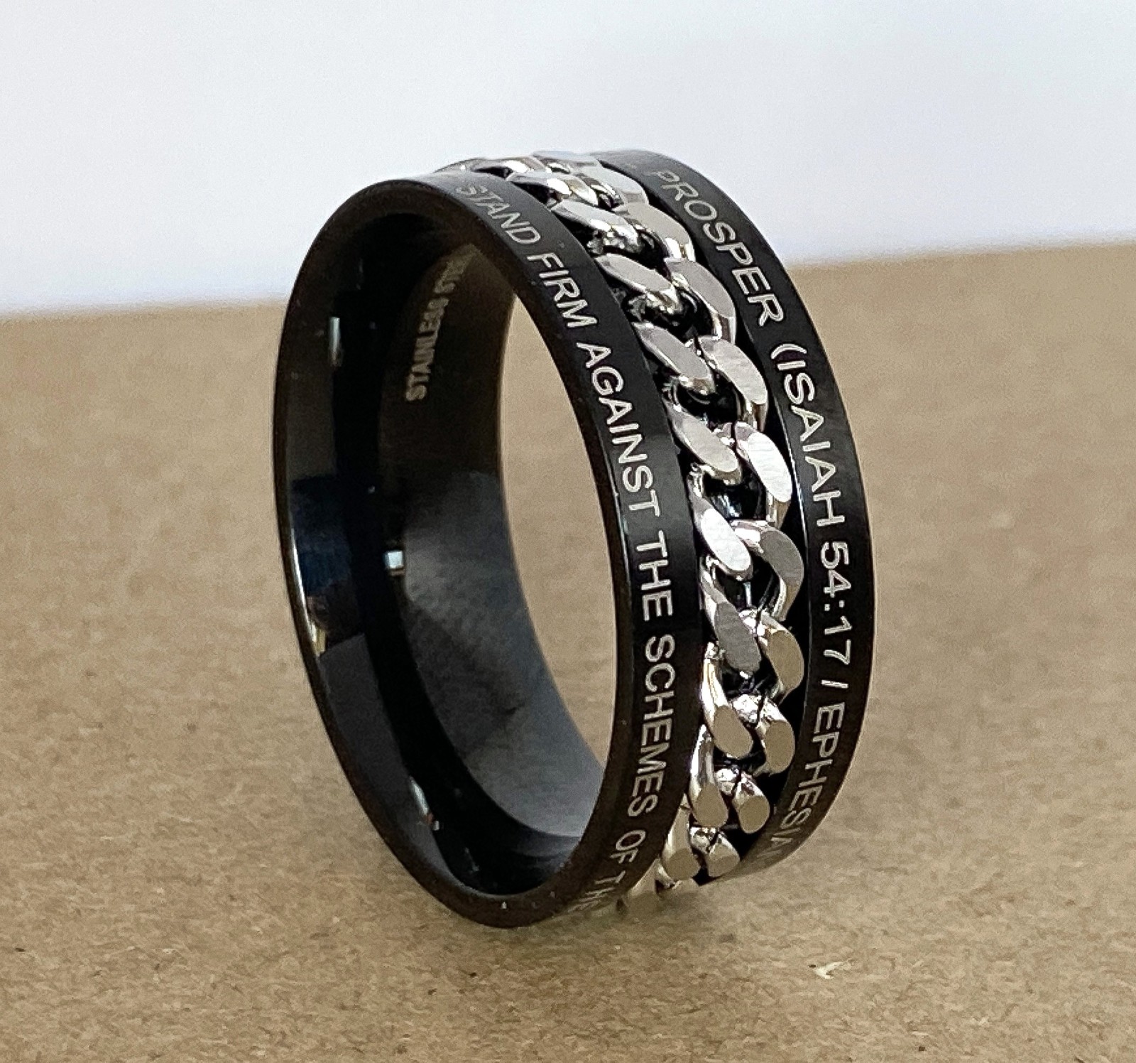Isaiah 54:17, Ephesians 6:11 Bible Verse Black Steel Ring w/Center Chain Spinner