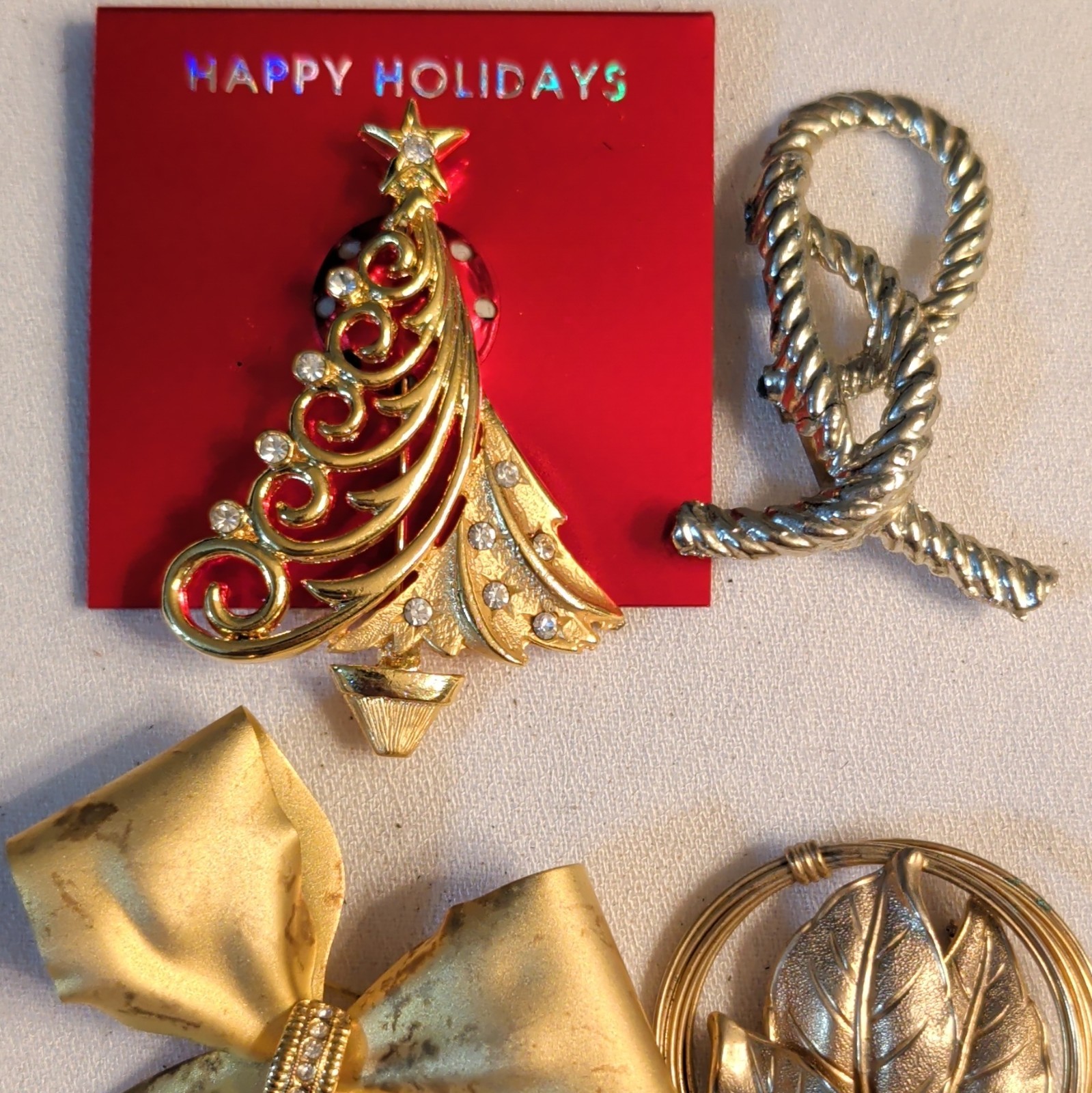 lot of 4 brooches, unmarked gold & silver tone, Christmas tree with rhinestones
