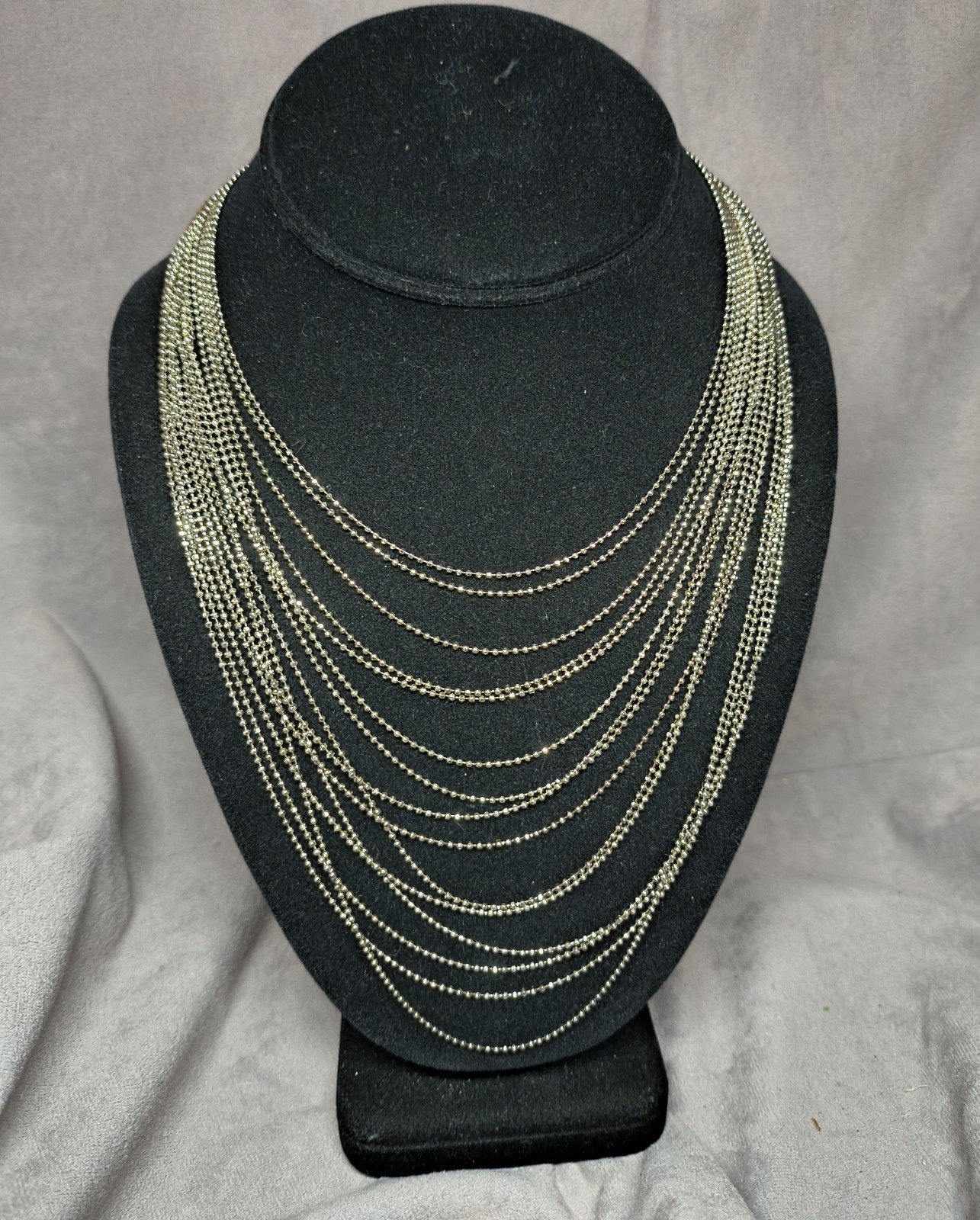 Multi Stranded Silver Toned Necklace