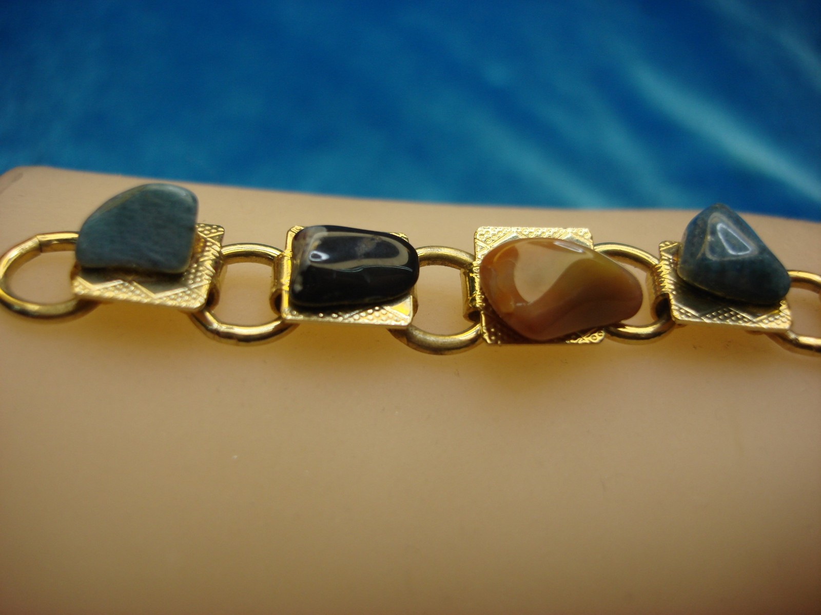GOLD TONE BRACELET WITH 11 DIFF. NATURAL GEMSTONES – 7″ – PRETTY