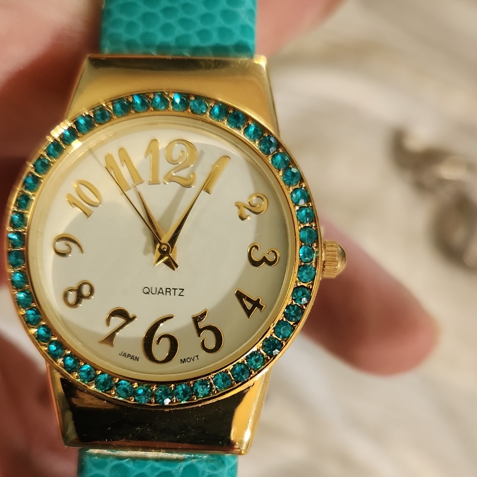 Quartz Analog Dress Watch White Dial Gold Case Blue Faux Leather Gem-Set Bezel