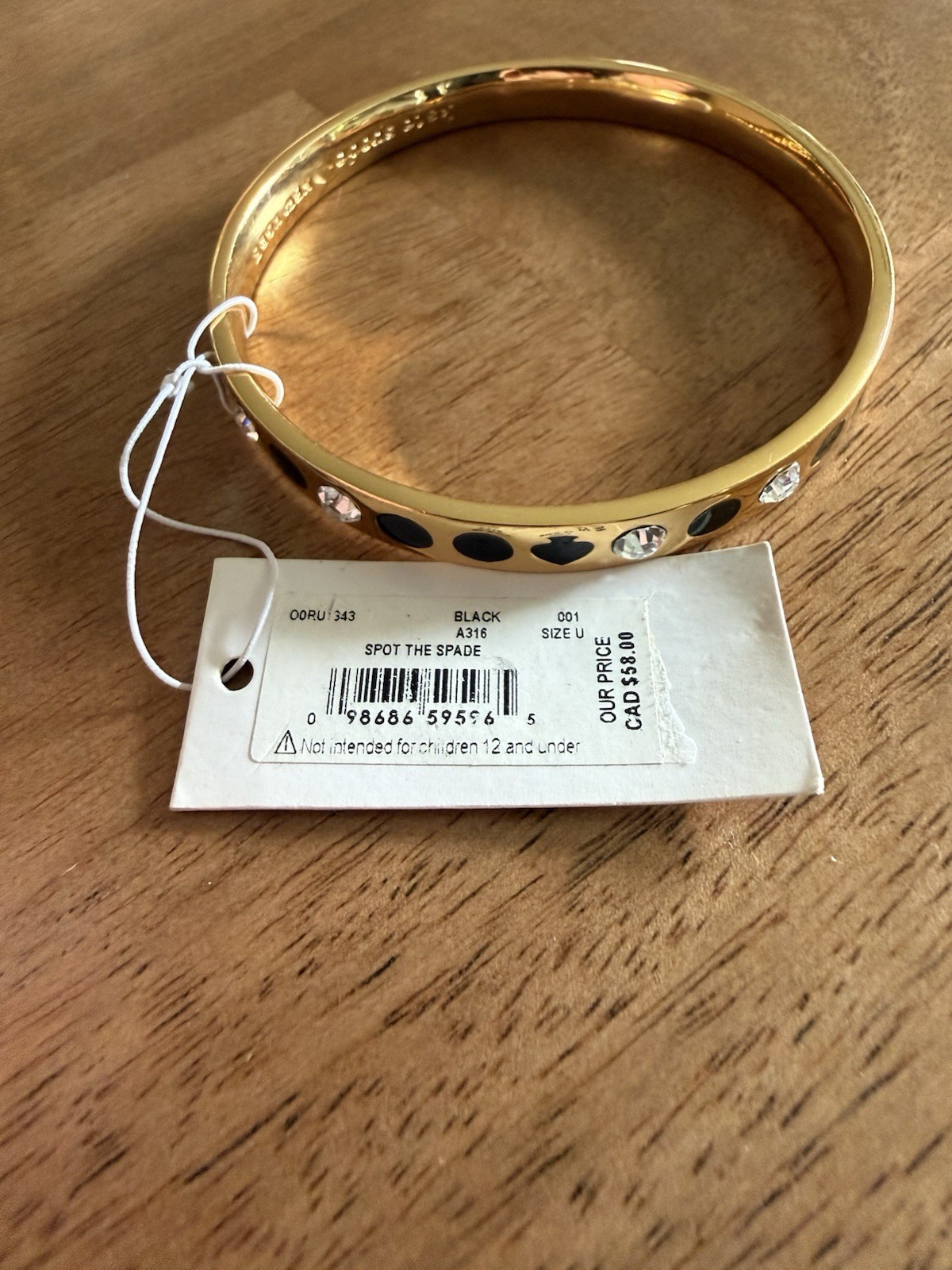 Kate Spade Bracelet Bangle “Spot the Spade” Gold Tone Bracelet