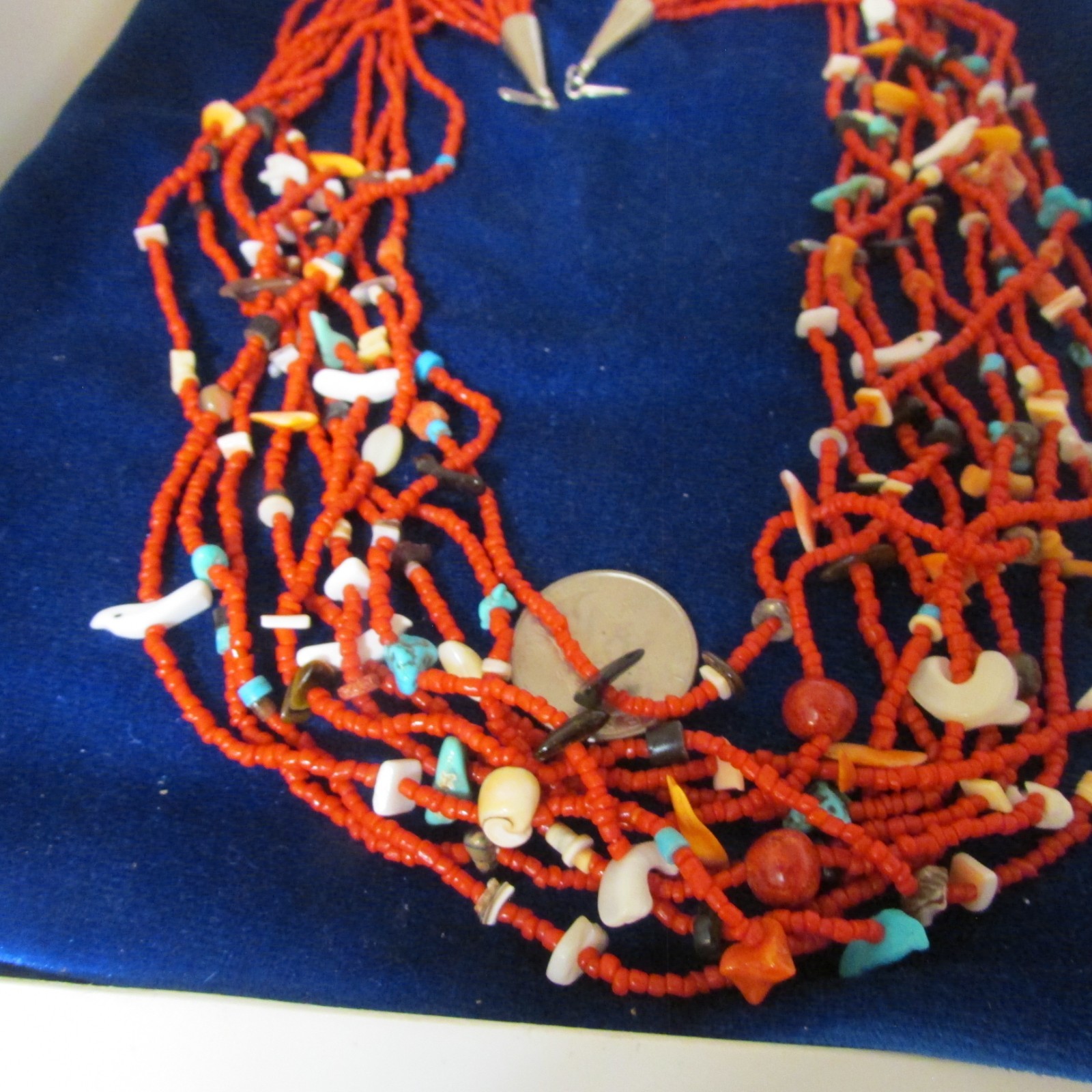 VINTAGE SOUTHWEST N.A, 10 STRAND CORAL NECKLACE, WITH ASSORTED FETISHES