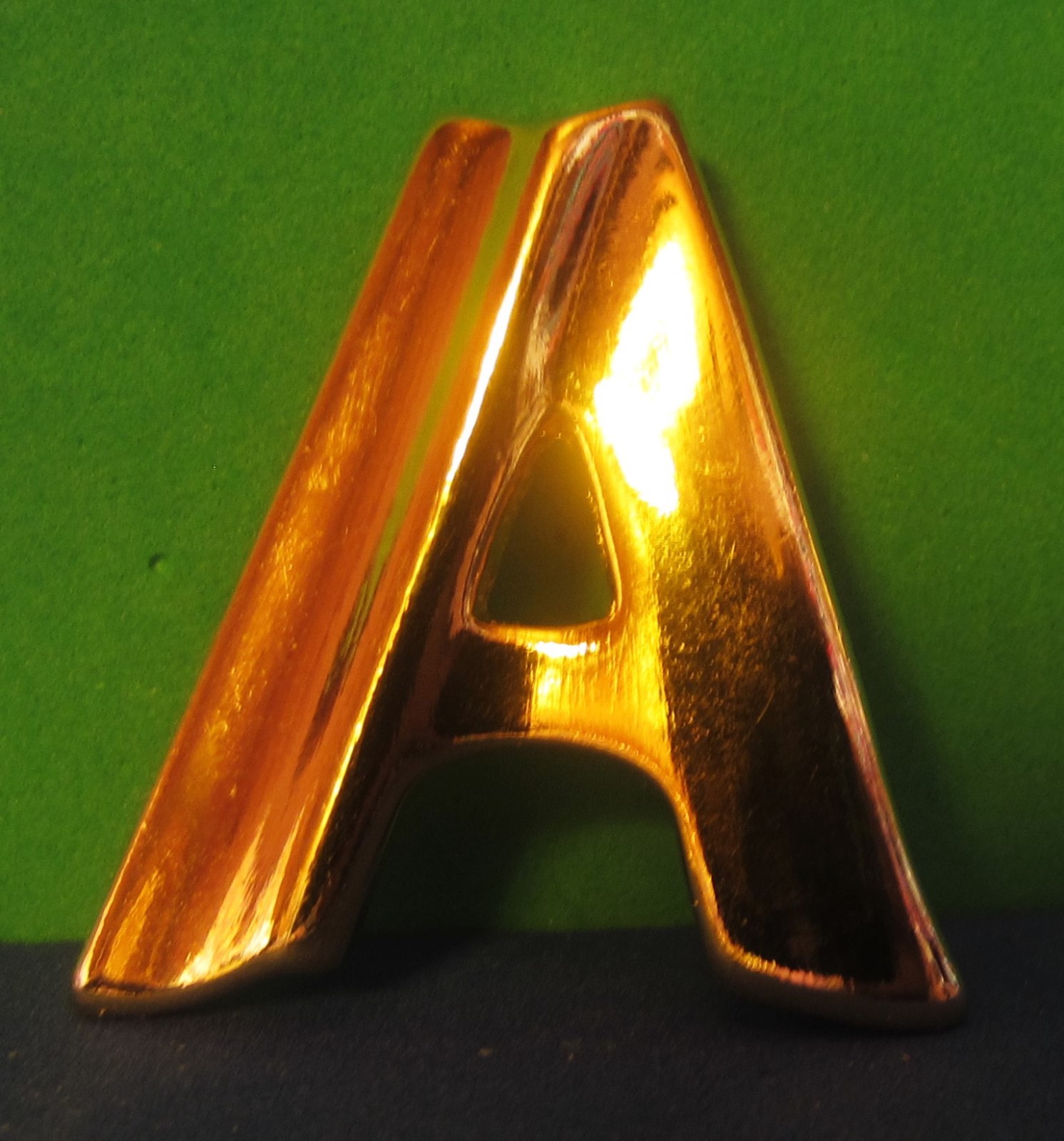 Un-marked Gold-tone A Shaped Pin/Brooch 1 1/4″ by 1 1/4″