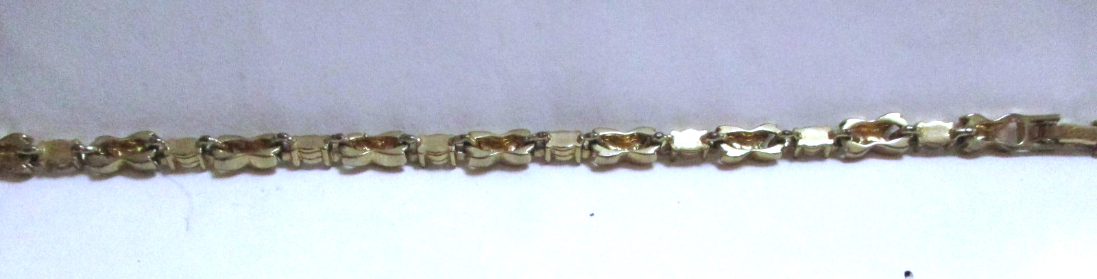 VINTAGE SIGNED AVON RHINESTONE TENNIS BRACELET X’S & O’S, GOLDTONE