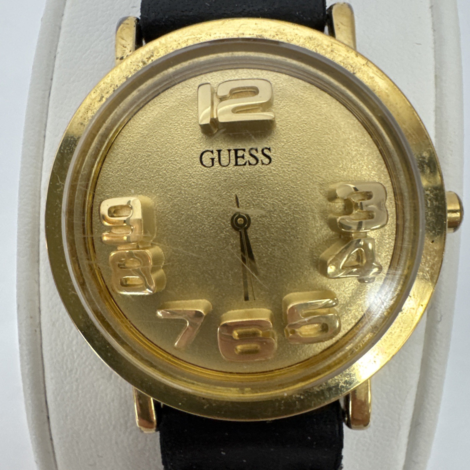 Vtg Guess watch gold-tone & raised 3D numbers and a black braided leather band.