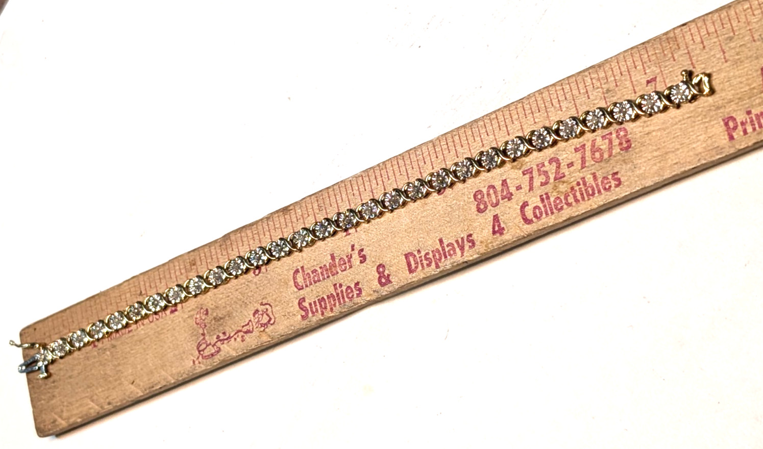 10K YELLOW GOLD DIAMOND TENNIS BRACELET 7.50 INCHES LONG & 6.50 GRAMS