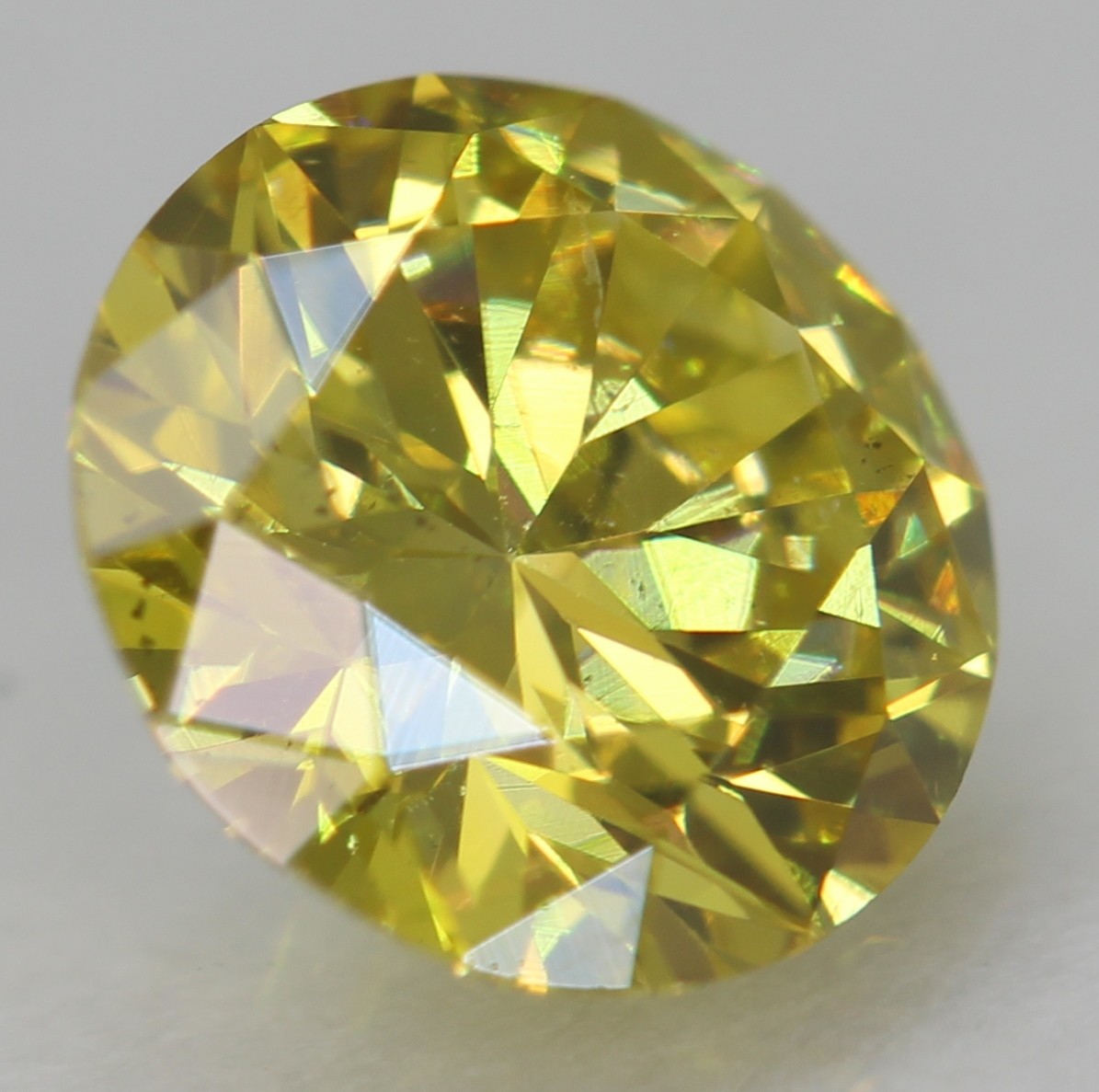 Cert 0.57 Carat Canary Yellow VVS2 Round Brilliant Natural Enhanced Diamond 5.5m