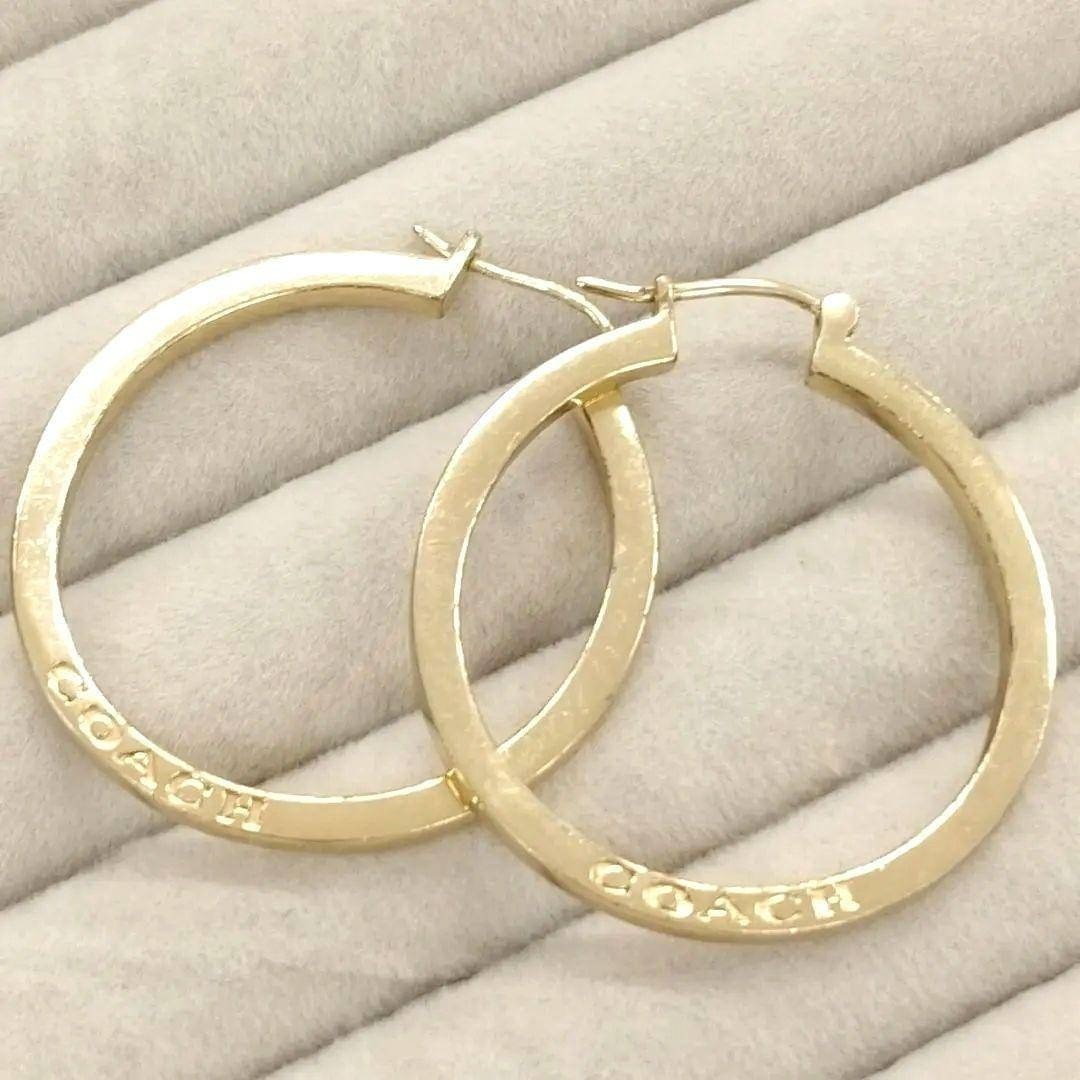 Near mint COACH logo x gold large hoop earrings
