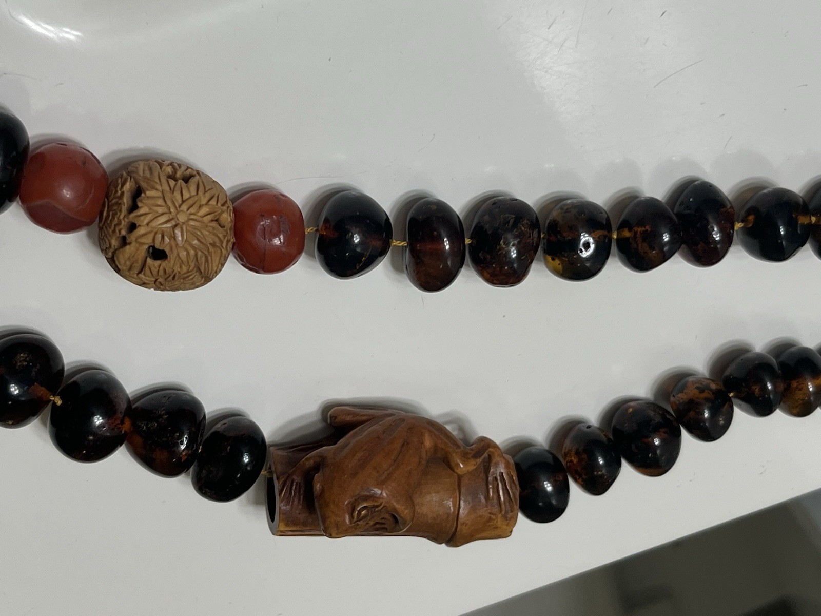 Baltic Amber Beaded Necklace Tied Nylon Cord with Carved Wood Frog/Floral Beads