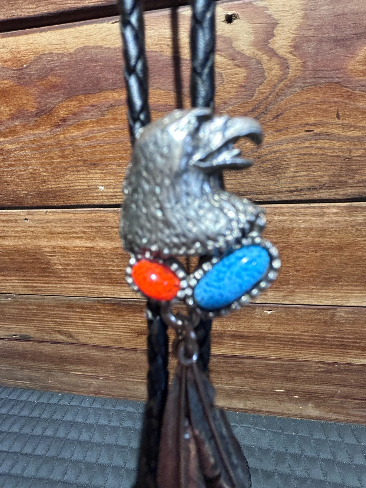 Eagle Head with Feathers Bolo Tie with manmade Turquoise and Ruby