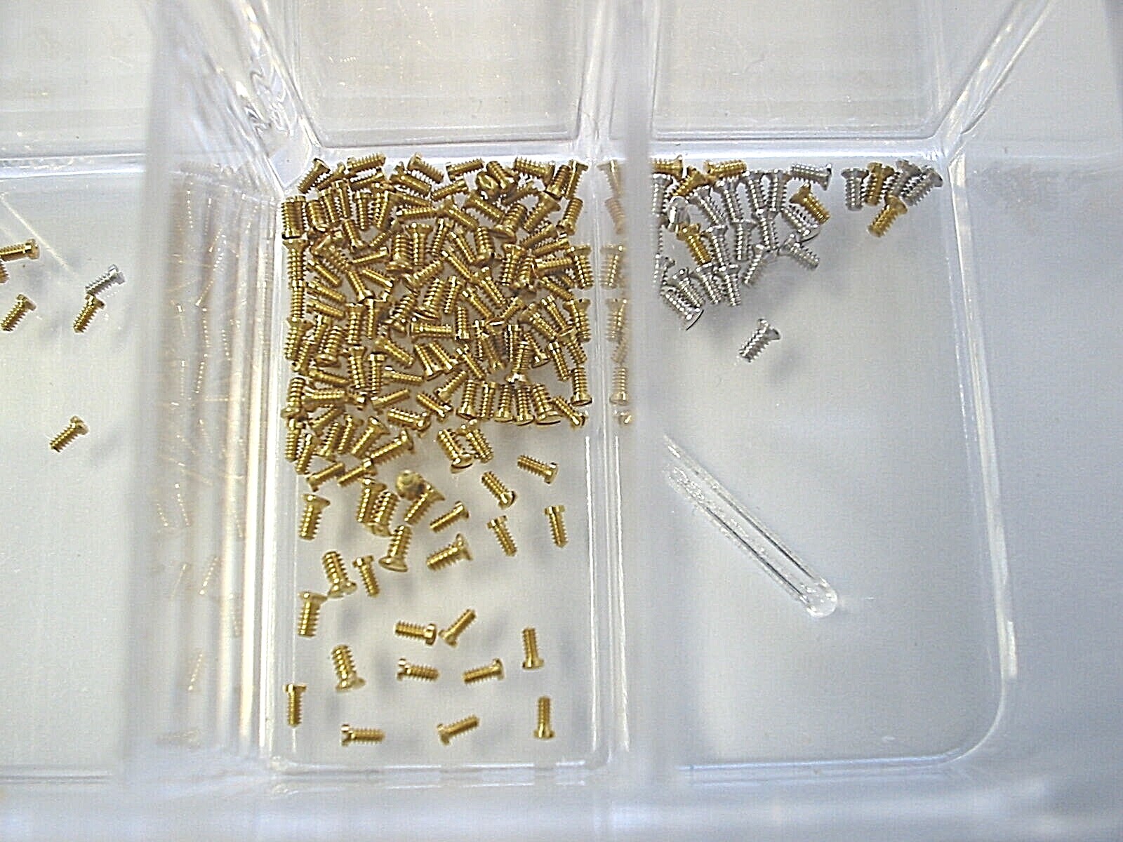 Choose any 4 new Piaget gold case back screws .70 mm / .90 mm. Other sizes too
