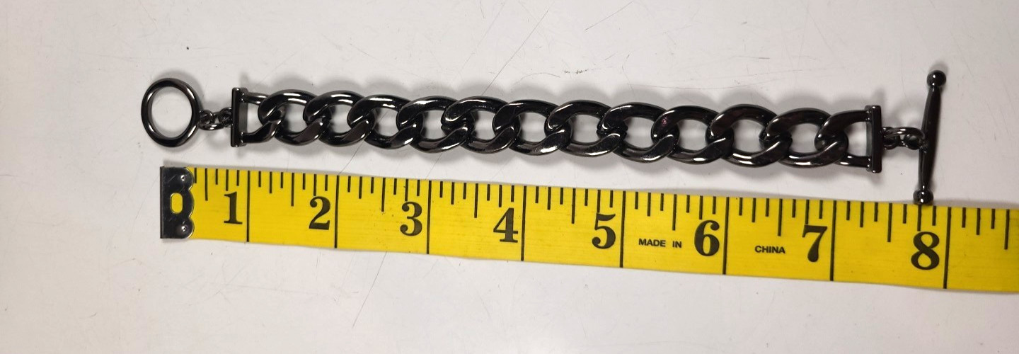 Gunmetal Toned Curb Link Bracelet with Crystal Accents.