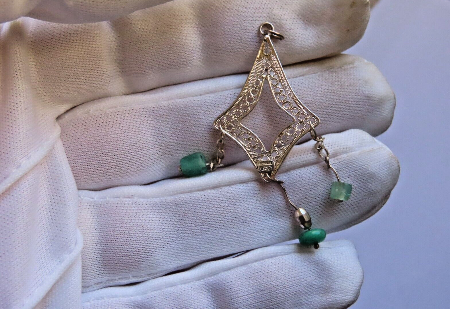 Handmade filigree silver pendant with Colombian emeralds