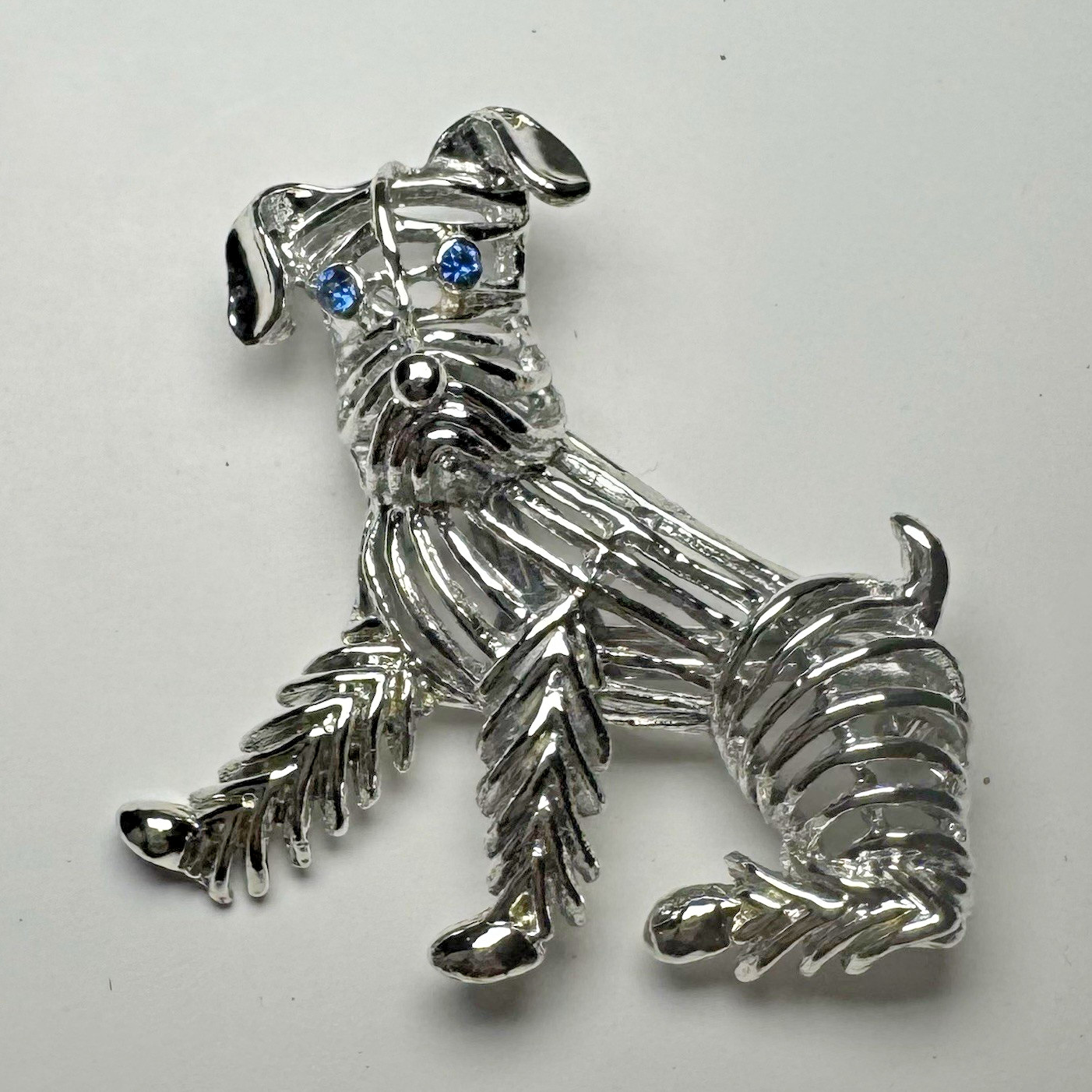 Vintages Gerry’s Silver Tone Dog Brooch Blue Rhinestone Eyes Animal Theme 2 Inch