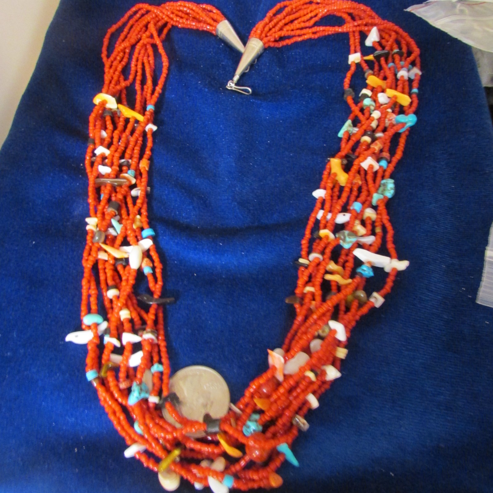 VINTAGE SOUTHWEST N.A, 10 STRAND CORAL NECKLACE, WITH ASSORTED FETISHES