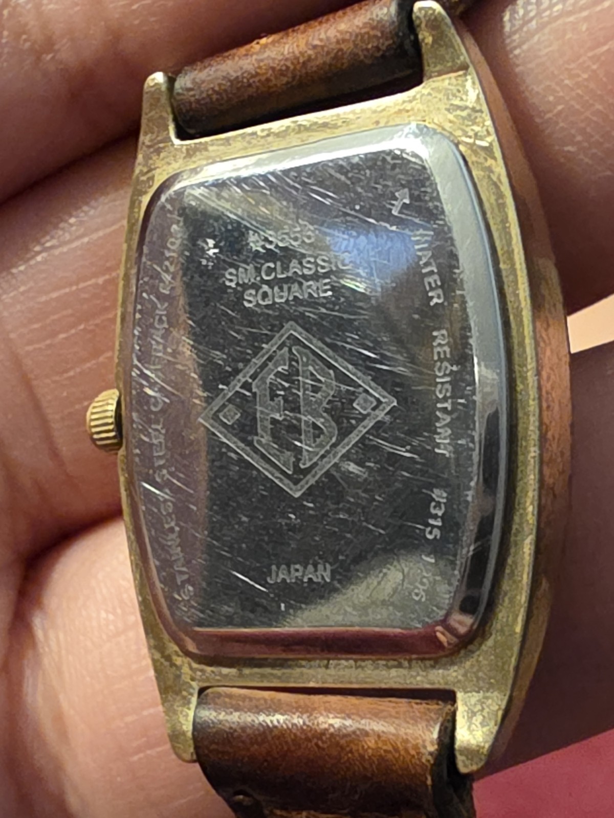 Vintage Eddie Bauer Watch Model 3556: Tonneau (barrel-shaped) Gold Tone Leather