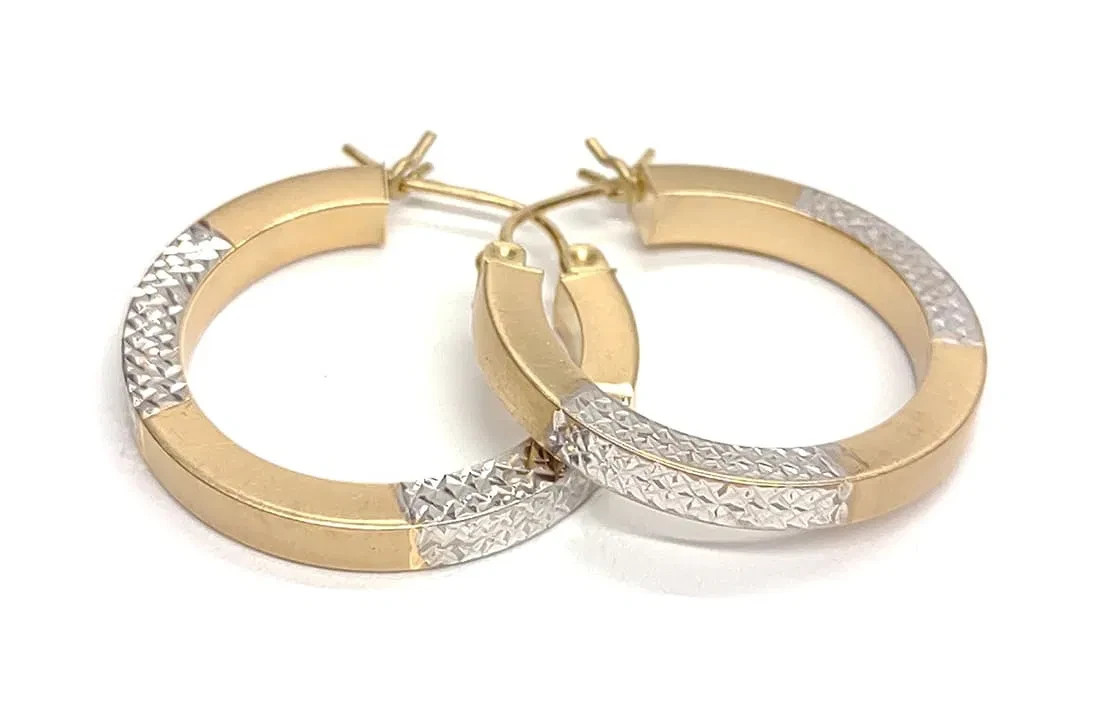 14 karat white and yellow gold hoop earrings. 25mm diameter