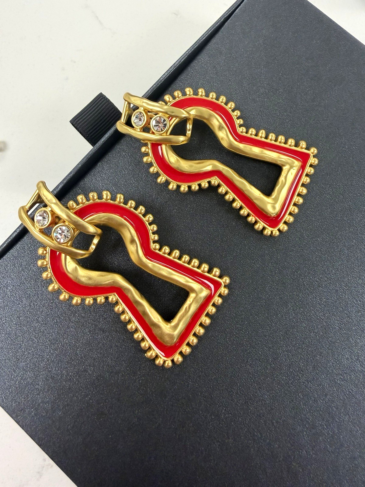 Surrealist, Schiaparelli style, keyhole stud earrings, gold with red enamel