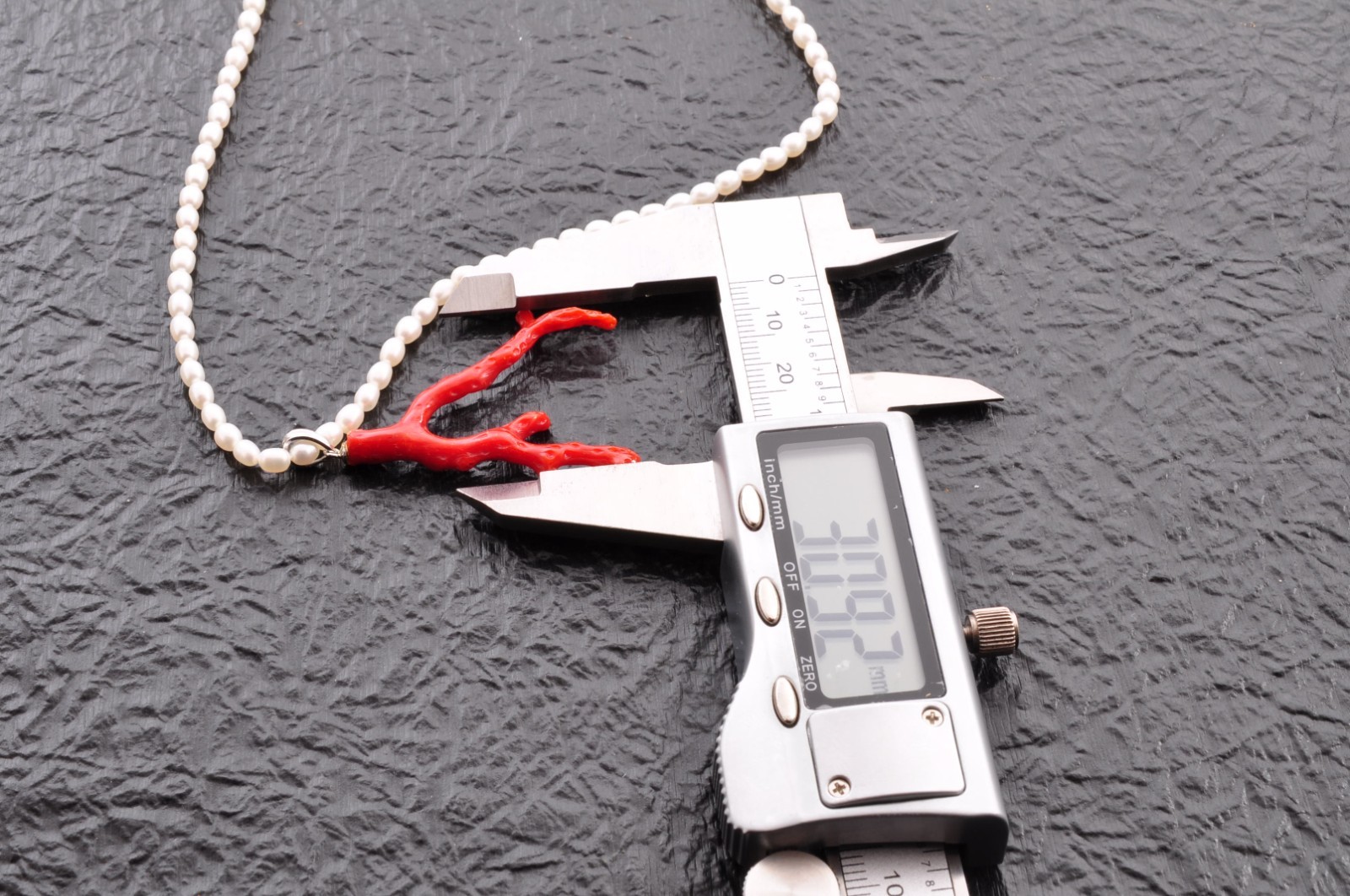 Sterling silver clasp, red coral and pearl pendant (total 54.0ct) Certification.