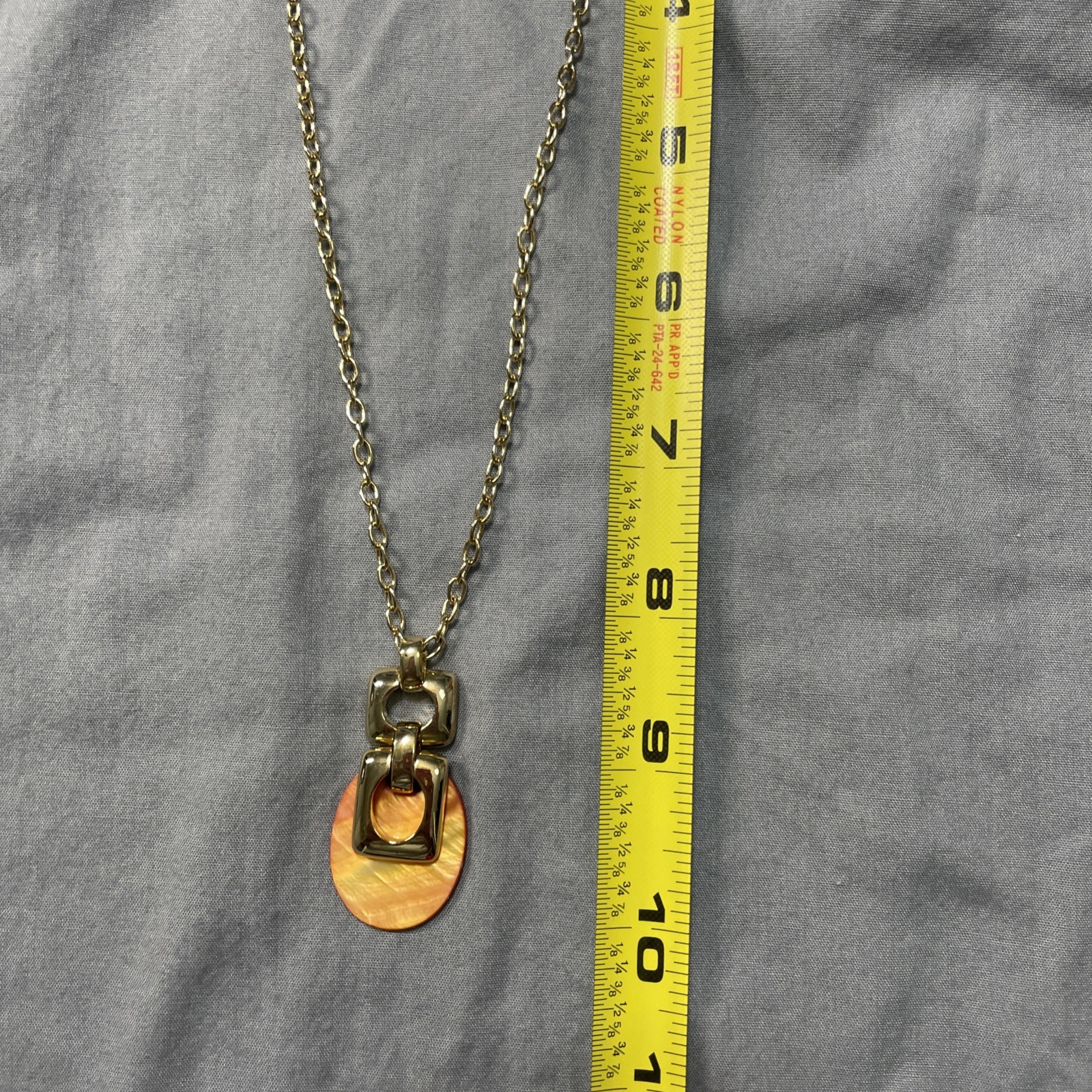 Orange And Good Pendant Necklace 10 Inches Long.