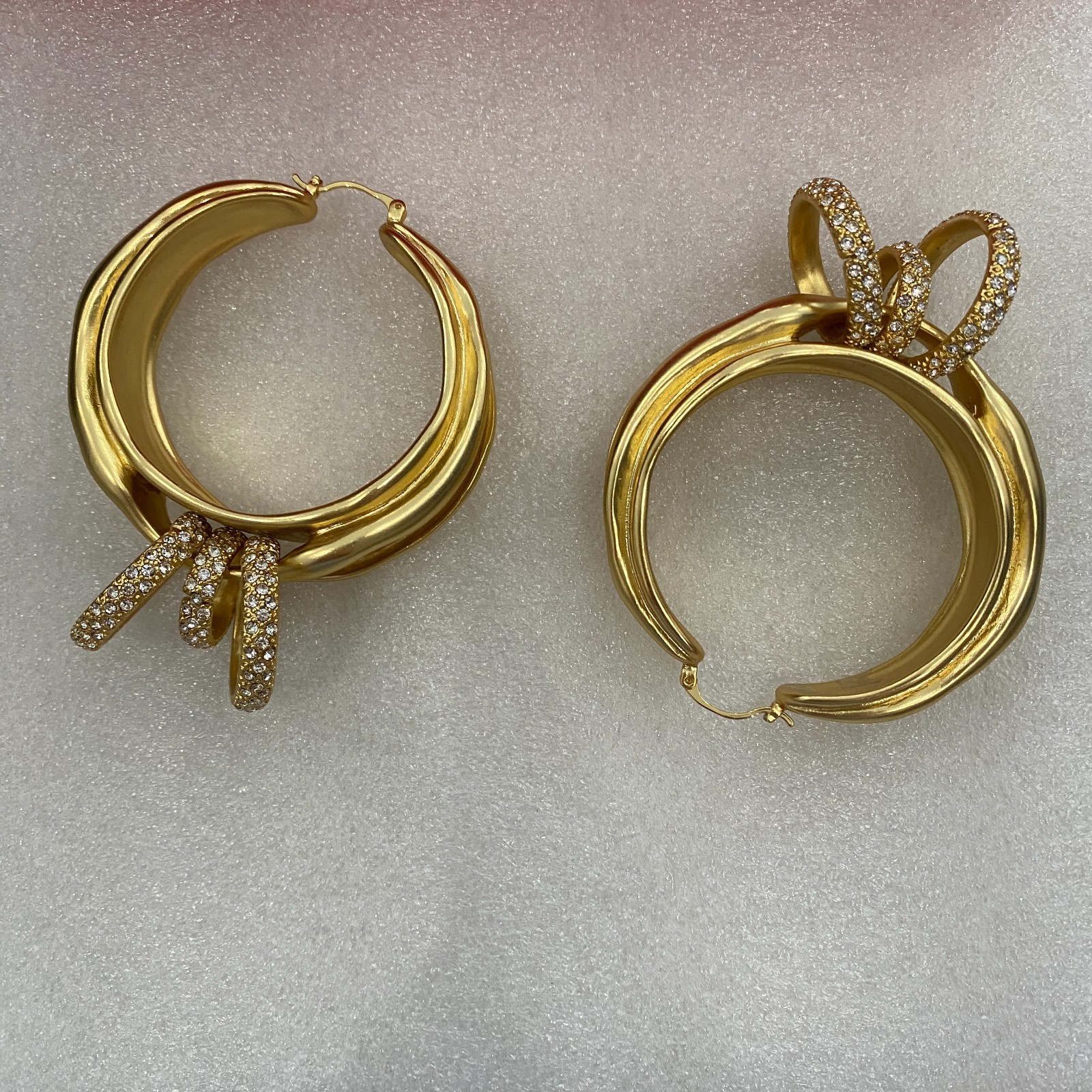 Schiaparelli Asymmetrical Twisted Gold Hoop Earrings With Pave Crystal Rings