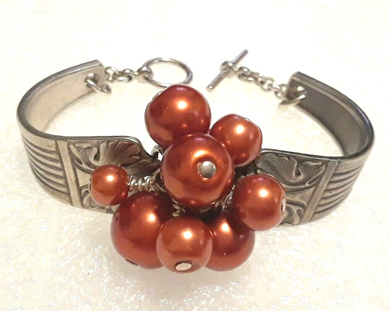 Spoon handle Bracelet. 2 piece with toggle clasp and burnt orange beads.