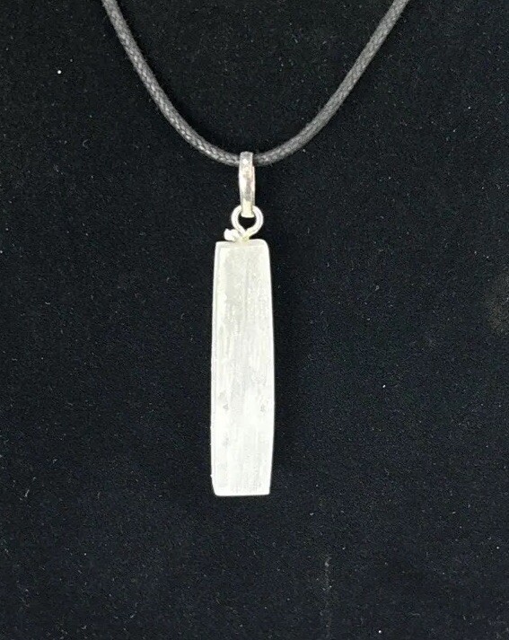 Selenite top drilled pendant with silver colored bail and adjustable cord