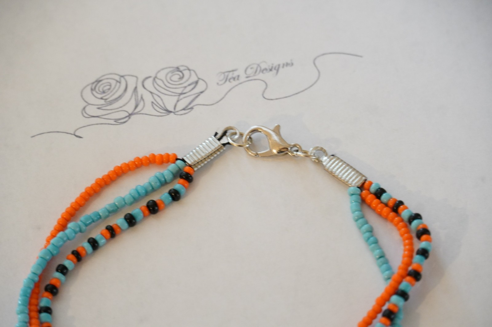 Multi-color Black, Blue, & Orange Glass Seed Bead 8″ Bracelet