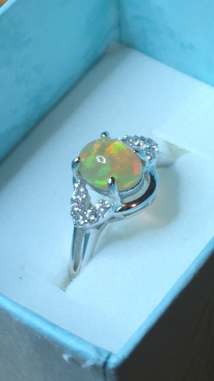 #138B- 0.95ct Genuine Ethiopian Welo Opal set in a Size 8.5 Sterling Silver Ring