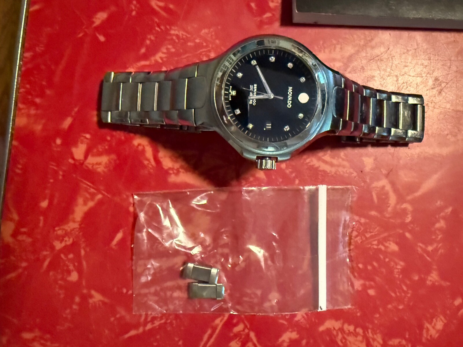 MOVADO 800 SERIES WATCH WITH BLCK BEZEL AND DIAMOND MAKERS – MENS WATCH