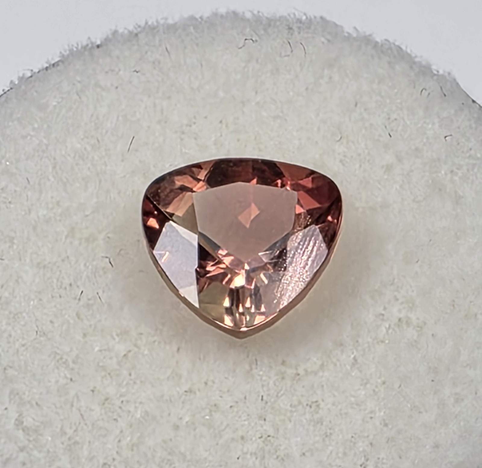 1.72 ct Oregon Sunstone –Trillion Cut – Reddish Orange Color Center Under Table