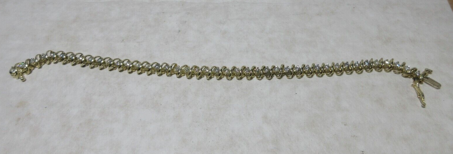 14K Yellow Gold tennis Bracelet, Wt 12.5g, locking 42 x 2.5mm diamonds si2 I1