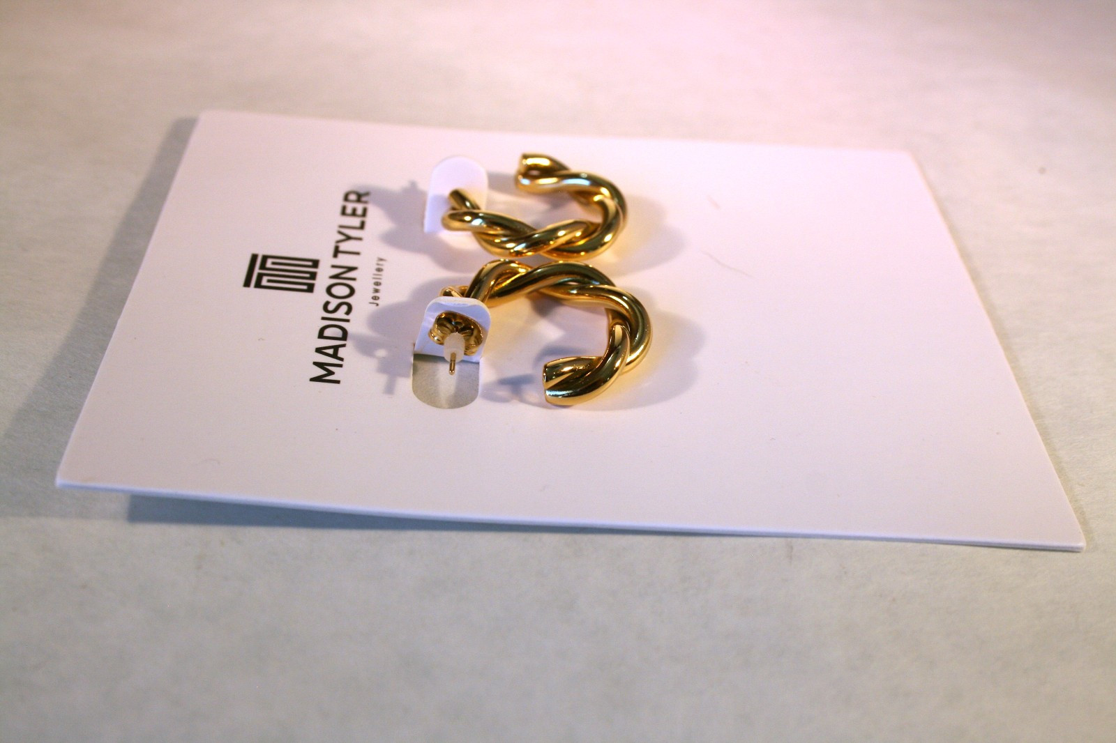 Madison Tyler gold tone shiny tubular twisted open hoop earrings 1 “