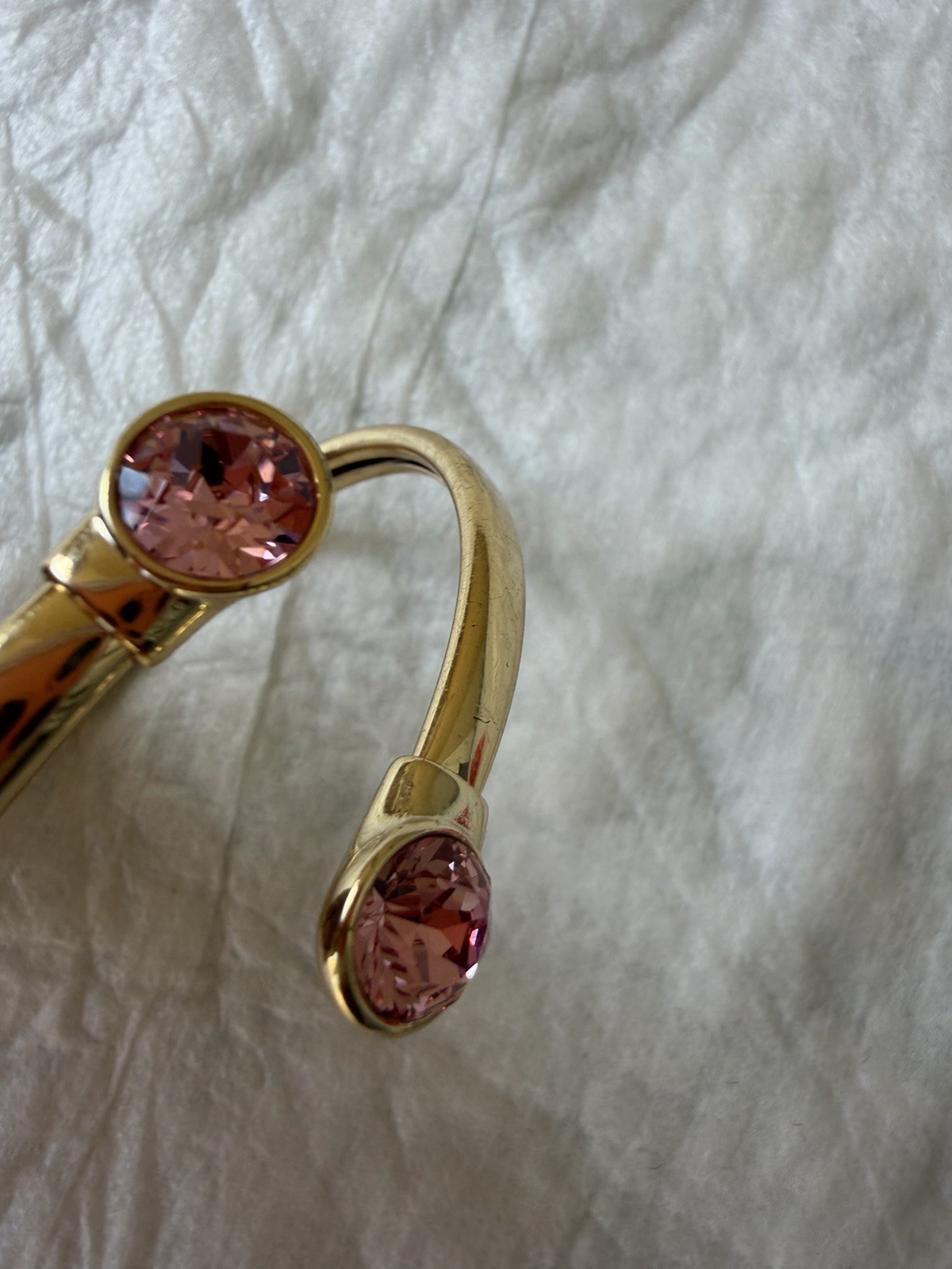 Goldtone Open-Ended Bangle Bracelet with Pink Gemstone Accents