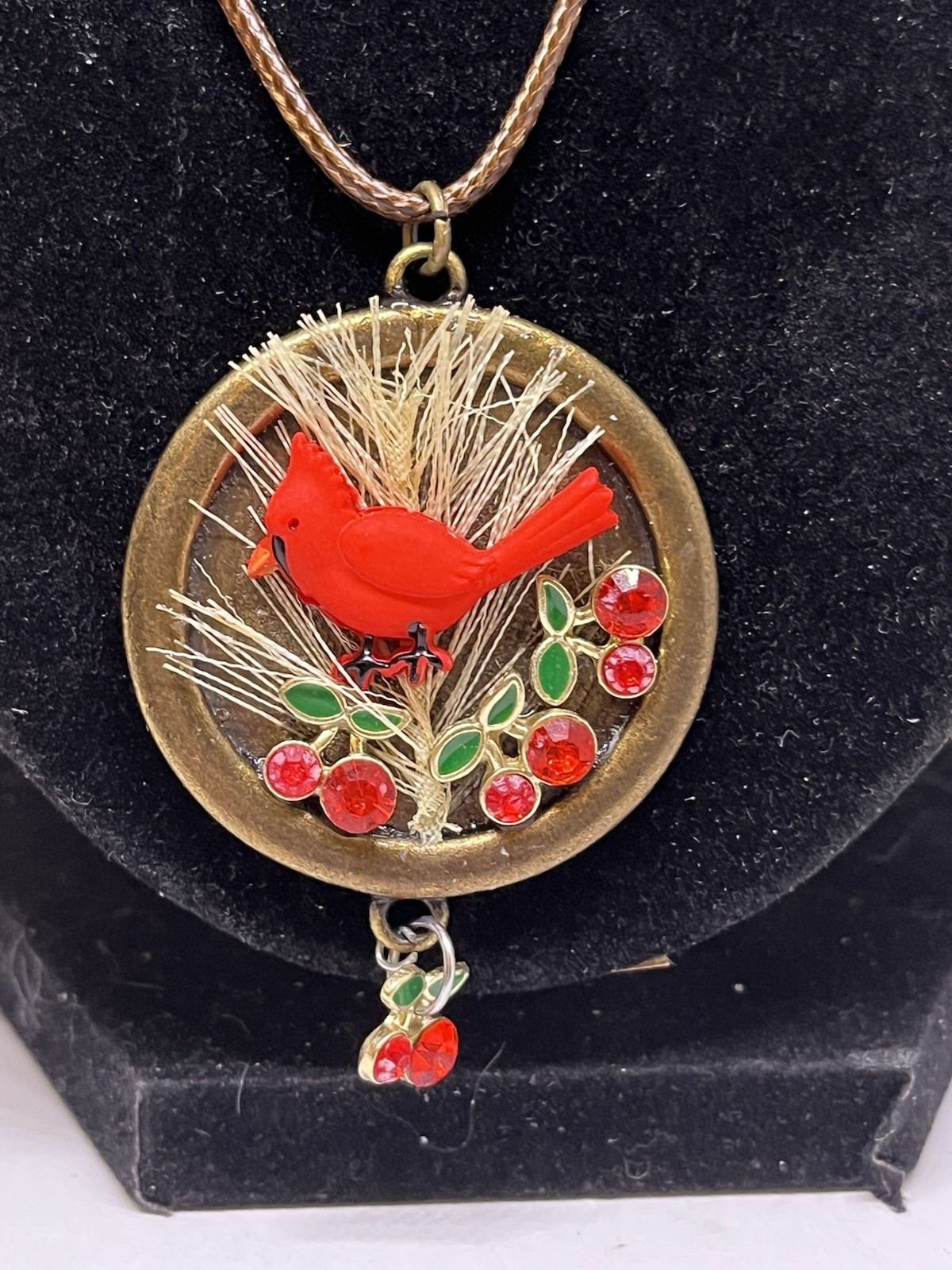 red bird necklace red crystals green enamel brass metal disk faux leather cord