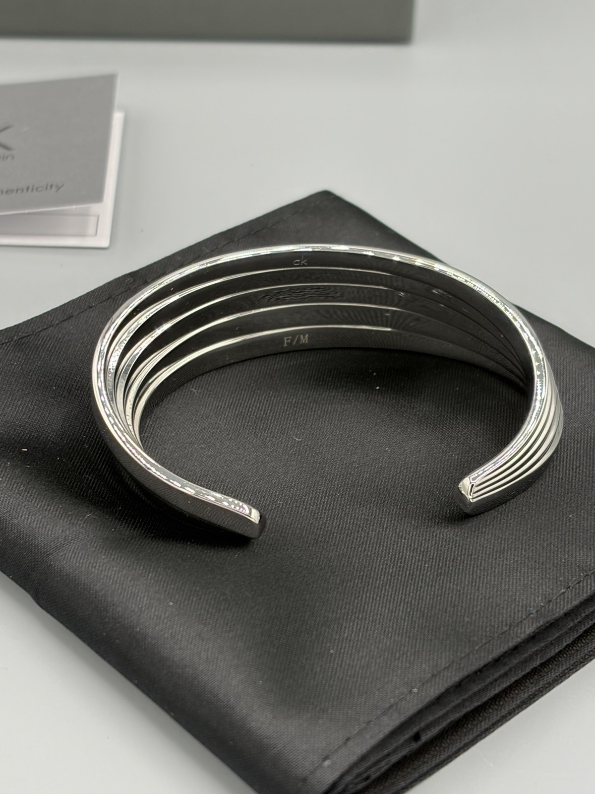 Calvin Klein Whisper Bangle Bracelet Stainless Steel Size M NWT Box Dustbag KJ76