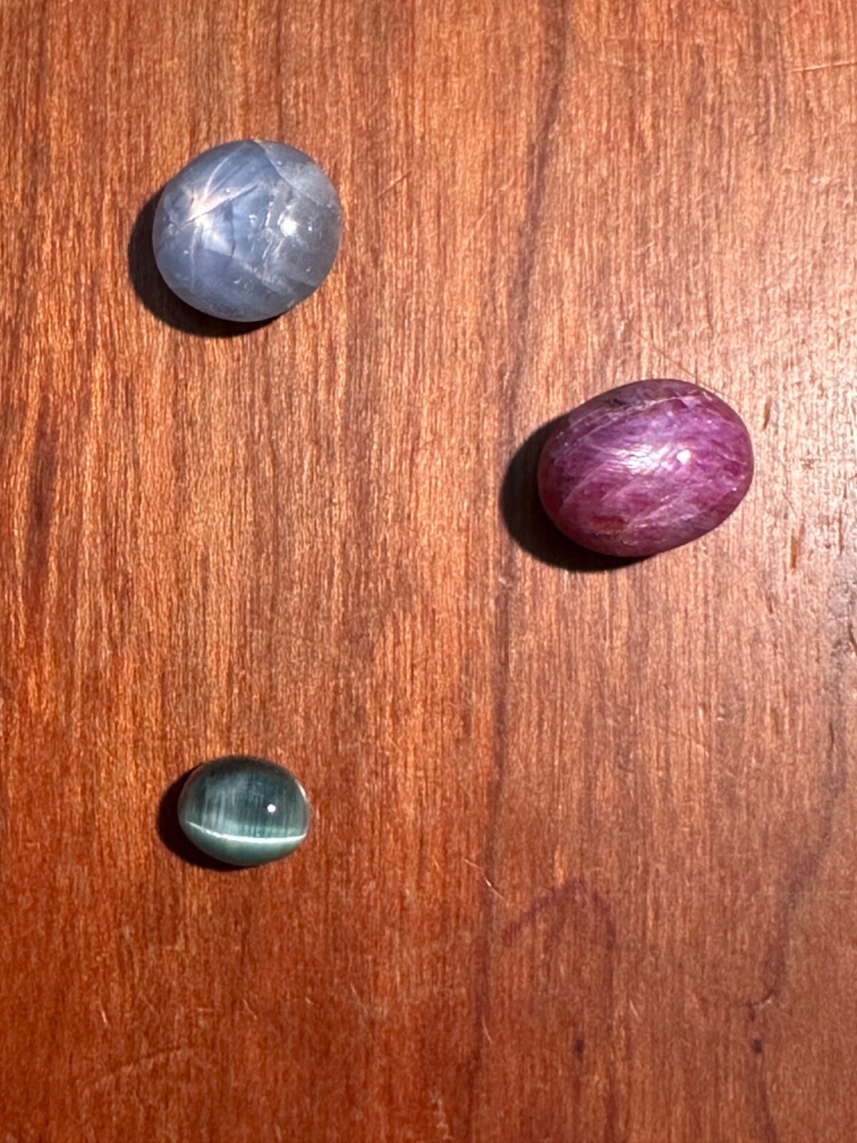 STAR SAPPHIRE CABOCHON 5.25CT, STAR RUBY SAPPHIRE 6.71CT, CAT’S EYE TOURMALINE 1