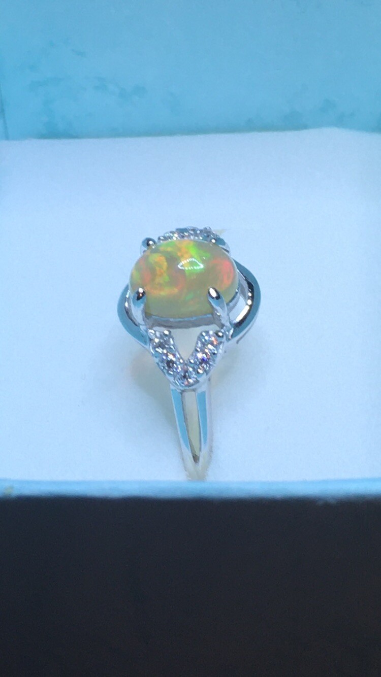 #138B- 0.95ct Genuine Ethiopian Welo Opal set in a Size 8.5 Sterling Silver Ring