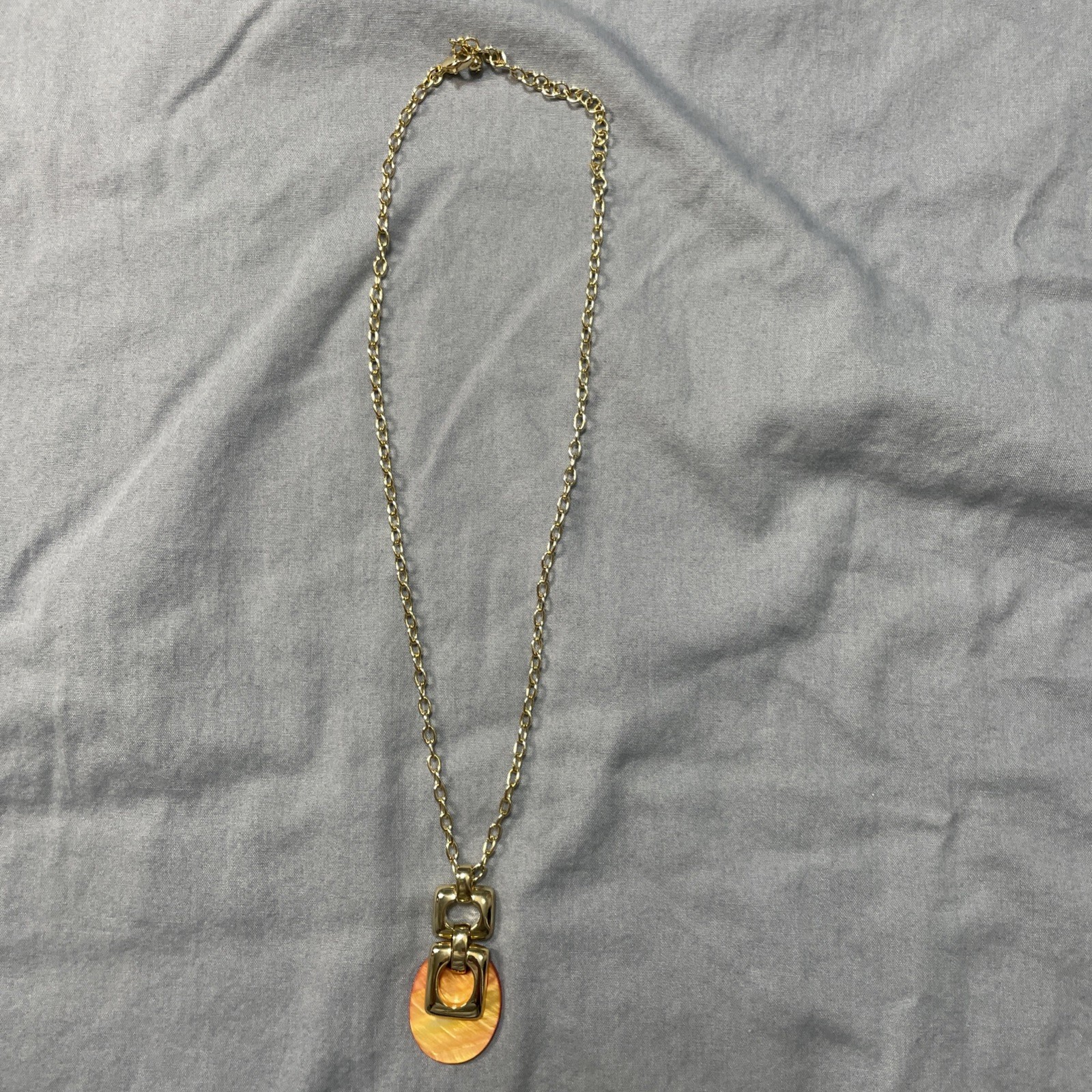 Orange And Good Pendant Necklace 10 Inches Long.