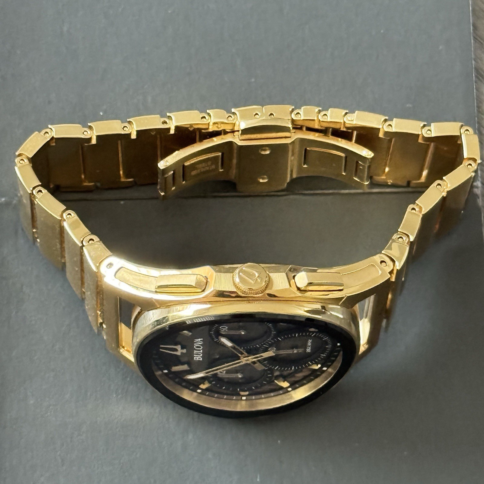 Bulova Curv Black Dial Men’s Watch – 97A144 Gold Tone Stainless