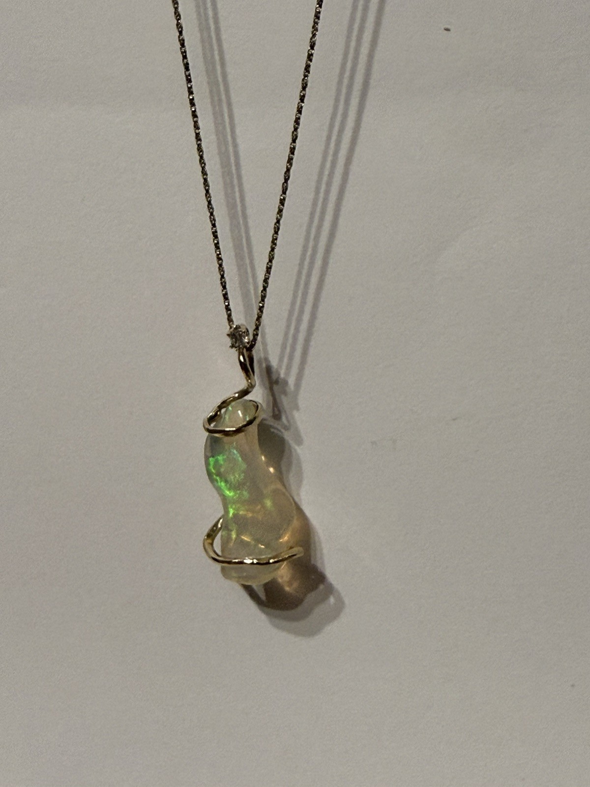 14k Solid Gold 4.90 carats opal and diamond pendant .