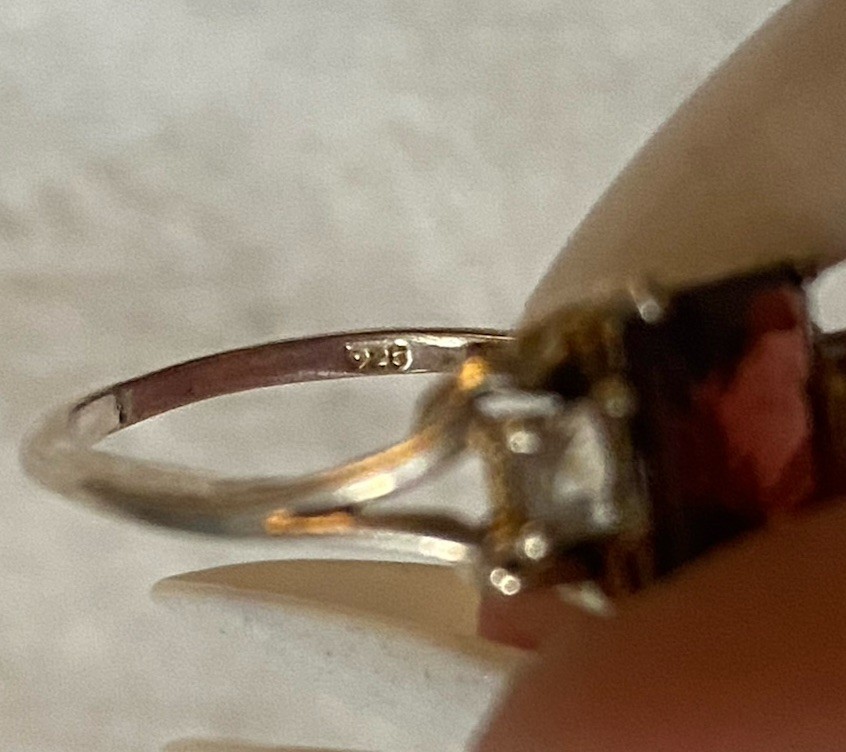 925 s.s. Emerald cut garnet with clear square stones 6 1/2 size