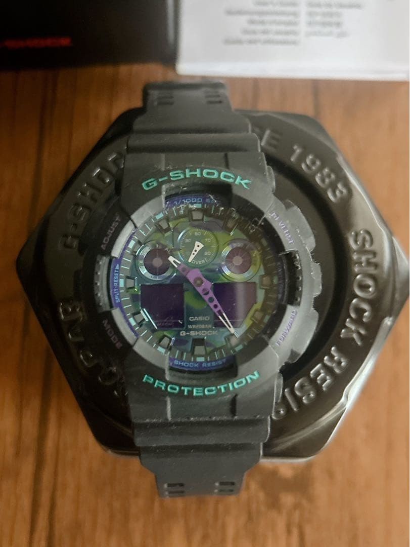 G SHOCK GA 100 1A purple camouflage