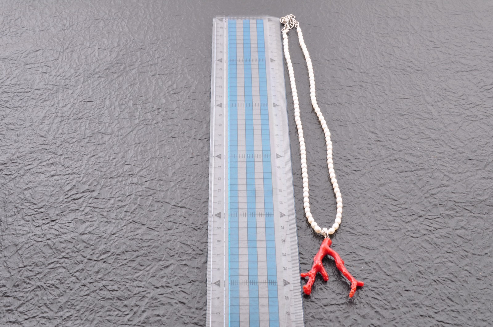 Sterling silver clasp, red coral and pearl pendant (total 54.0ct) Certification.