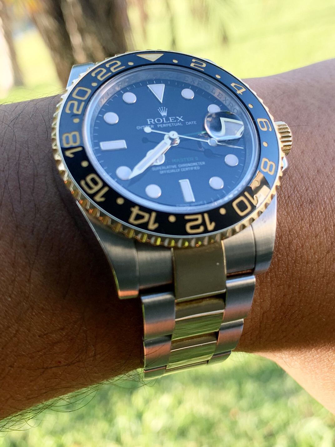 Rolex GMT-Master II Two Tone Gold Ceramic Bezel Black Dial Bidirectional Bezel